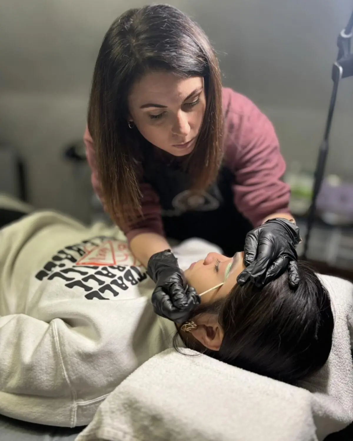 Kim Foerster performing professional waxing service at Royal Glow Beauty in Boardman Ohio